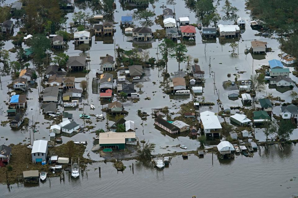 Floodwaters slowly recede in the aftermath of Hurricane Ida in Lafitte, La., Sept. 1, 2021. Federal meteorologists said Thursday, Aug. 4, 2022, this hurricane season may not be quite as busy as they initially thought, but it should still be more active than normal.