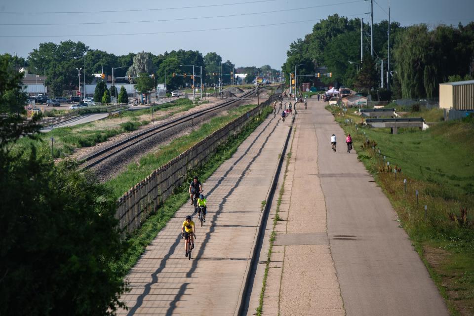 People ride bicycles along the Mason Trail during Fort Collins' 35th annual Summer Bike to Work (or Wherever) Day on June 28, 2023.