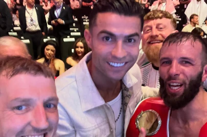 A picture of Cristiano Ronaldo posing for pictures with Anthony Cacace