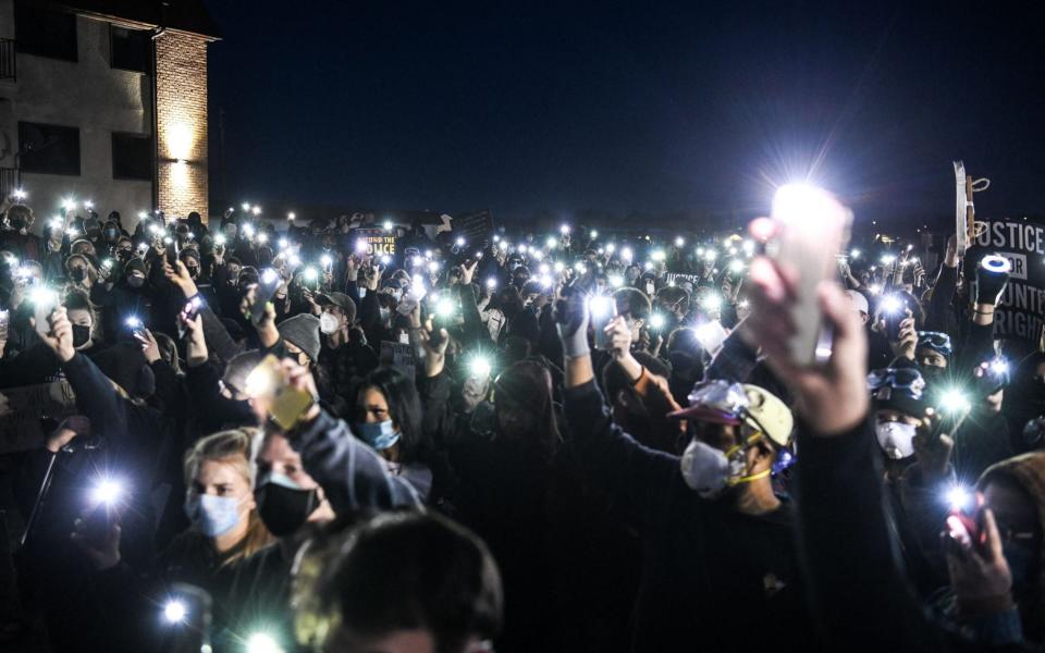 Protesters returned to Brooklyn Center on Friday night - AFP