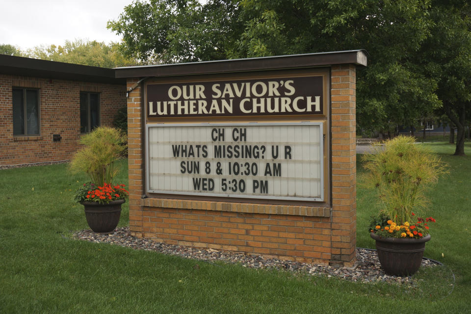 A humorous sign is seen outside Our Savior's Lutheran Church in Stillwater, Minn., on Wednesday Sept. 27, 2023. The large congregation's pastor is one of many around the country who's integrating faith-focused self-care practices to be a more effective leader at a time when growing numbers of clergy experience burnout. (AP Photo/Giovanna Dell'Orto)