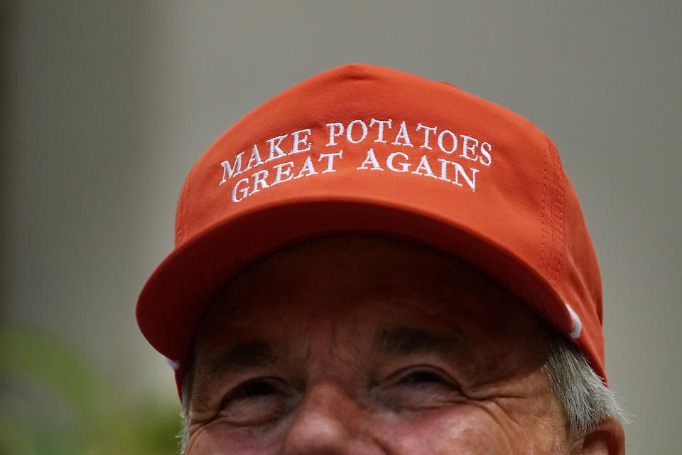 Dan Moss, of the National Potato Council, dons his 'Make Potatoes Great Again' hat before joining U.S. President Donald Trump in the Roosevelt Room at the White House. (Photo: Chip Somodevilla via Getty Images)