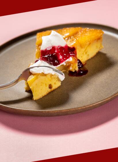 EL SEGUNDO, CA - THURSDAY, MAY 25, 2023 - A slice of a Pineapple Upside Down Cake toped with whipped cream and cherry compote, photographed in the LAT Test Kitchen. The batter is spread over the pineapple in the baking tray. (Ricardo DeAratanha/Los Angeles Times)
