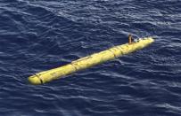 The Bluefin-21 Autonomous Underwater Vehicle sits in the water after being deployed from the Australian Defence Vessel Ocean Shield in the southern Indian Ocean during the continuing search for the missing Malaysian Airlines flight MH370 in this picture released by the Australian Defence Force April 17, 2014. REUTERS/Australian Defence Force/Handout via Reuters