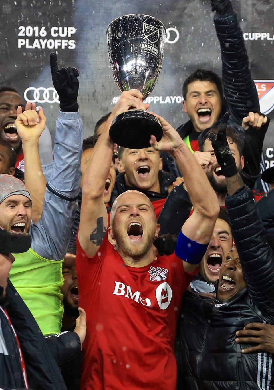 <p>Michael Bradley #4 of Toronto FC and teammates celebrate with the Eastern Conference Trophy following the MLS Eastern Conference Final, Leg 2 game against Montreal Impact at BMO Field on November 30, 2016 in Toronto, Ontario, Canada. (Photo by Vaughn Ridley/Getty Images) </p>