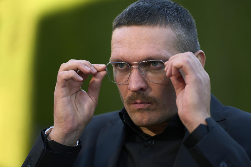 Ukrainian heavyweight boxing champion Oleksandr Usyk, gestures, during an interview with The Associated Press in Valencia, Spain, Thursday, Nov. 9, 2023. The heavyweight title fight between Oleksandr Usyk and Tyson Fury now appears likely for February. Though Usyk isn’t convinced. The Ukrainian has his doubts because the fight had been planned for Dec. 23 in Saudi Arabia. (AP Photo/Jose Breton)