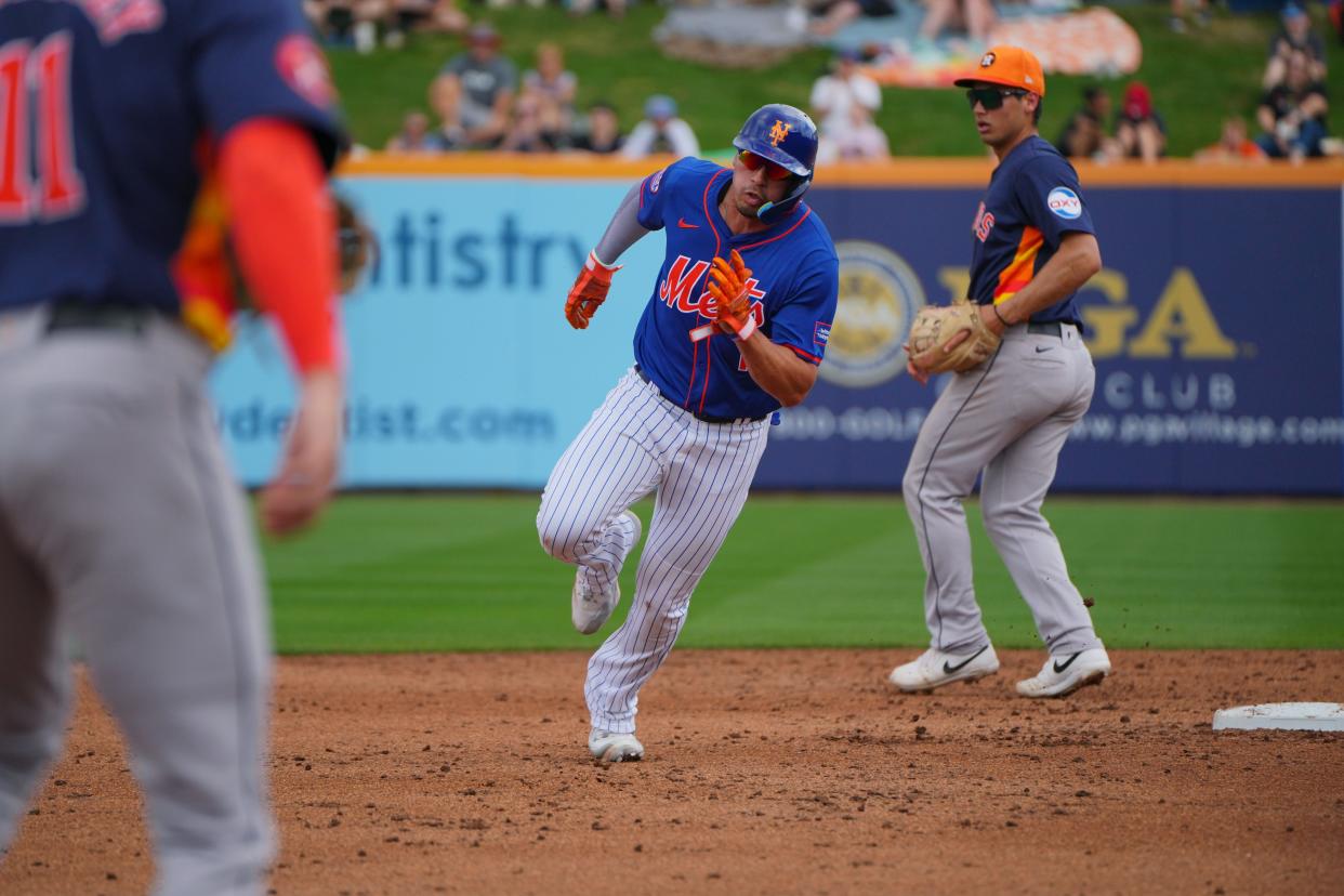 Mar 3, 2024; Port St. Lucie, Florida, USA; New York Mets right fielder Tyrone Taylor (15) goes from first to third base in the second inning against the Houston Astros at Clover Park. Mandatory Credit: Jim Rassol-USA TODAY Sports