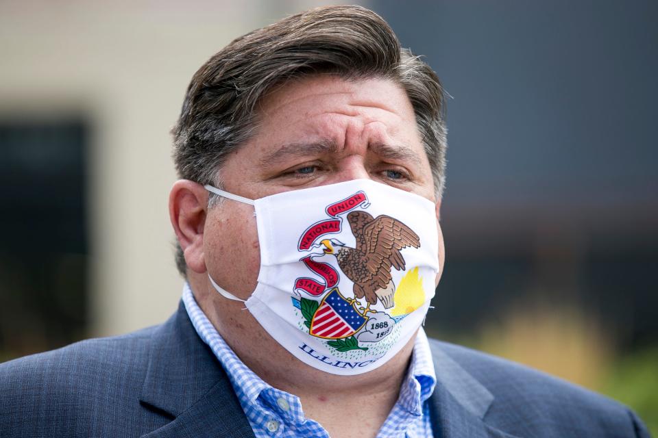 Gov. JB Pritzker meets with attendees at City Market in Rockford, Ill. on July 16, 2020.