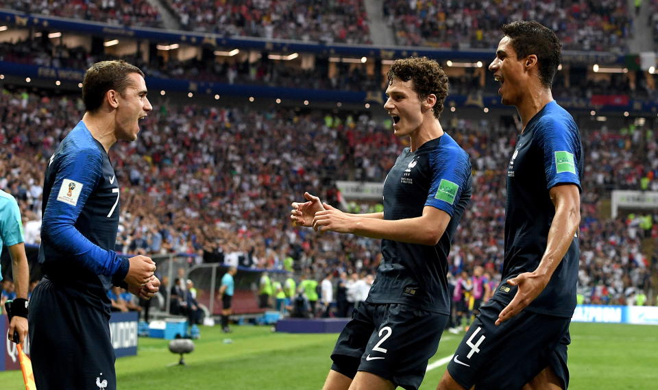 Moscow (Russian Federation), 15/07/2018.- (L-R) Antoine Griezmann of France reacts with Benjamin Pavard of France and Raphael Varane of France.