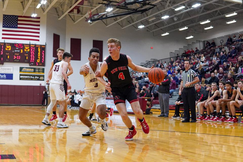 New Philadelphia's Michael Vickers heads to the hoop Tuesday night.