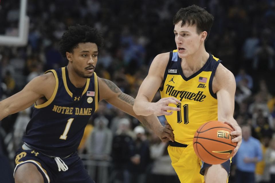 Marquette's Tyler Kolek tries to get past Notre Dame's Julian Roper II during the first half of an NCAA college basketball game Saturday, Dec. 9, 2023, in Milwaukee. (AP Photo/Morry Gash)