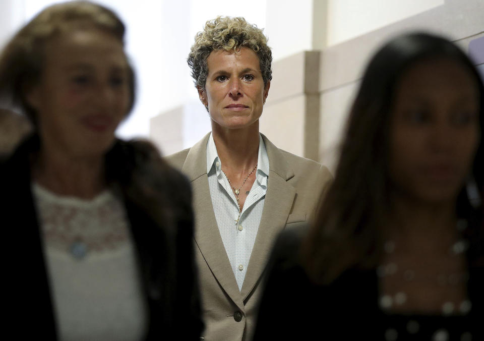 FILE - Andrea Constand returns to the courtroom during a lunch break at the sentencing hearing for Bill Cosby at the Montgomery County Courthouse in Norristown, Pa., on Sept. 24, 2018. The jury – deliberating as the #MeToo movement took hold – convicted the aging TV star of drugging and sexually assaulting her in 2005. The judge sent him to prison. Then a Pennsylvania appeals court found the prosecution case flawed and freed Cosby last year. (David Maialetti/The Philadelphia Inquirer via AP, Pool, File)