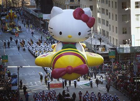 The Hello Kitty balloon float makes its way down 6th Avenue during the 87th Macy's Thanksgiving day parade in New York November 28, 2013. REUTERS/Carlo Allegri