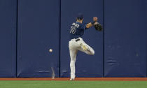 Tampa Bay Rays center fielder Kevin Kiermaier chases after a double hit by Miami Marlins' Jesus Sanchez during the fourth inning of a baseball game Friday, Sept. 24, 2021, in St. Petersburg, Fla. (AP Photo/Steve Nesius)