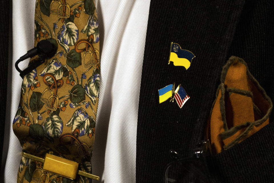 Ukraine and American flag pins worn by former President of Ukraine Viktor Yushchenko during an interview at the Urban League of Philadelphia, Monday, May 13, 2024. Yushchenko said the long delay by the U.S. Congress in approving military aid for his country was “a colossal waste of time,” that sent a signal to Russian President Vladimir Putin to inflict more suffering in the two-year invasion and would only prolong the war. (AP Photo/Joe Lamberti)