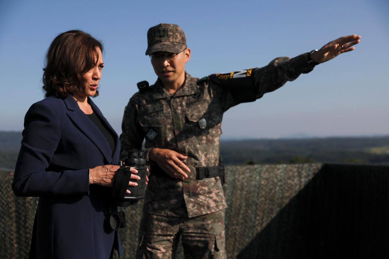 U.S. Vice President Kamala Harris, left, holds binoculars at the military observation post as she visits the demilitarized zone (DMZ) separating the two Koreas, in Panmunjom, South Korea Thursday, Sept. 29, 2022. (Leah Millis/Pool Photo via AP) ORG XMIT: TKMY319