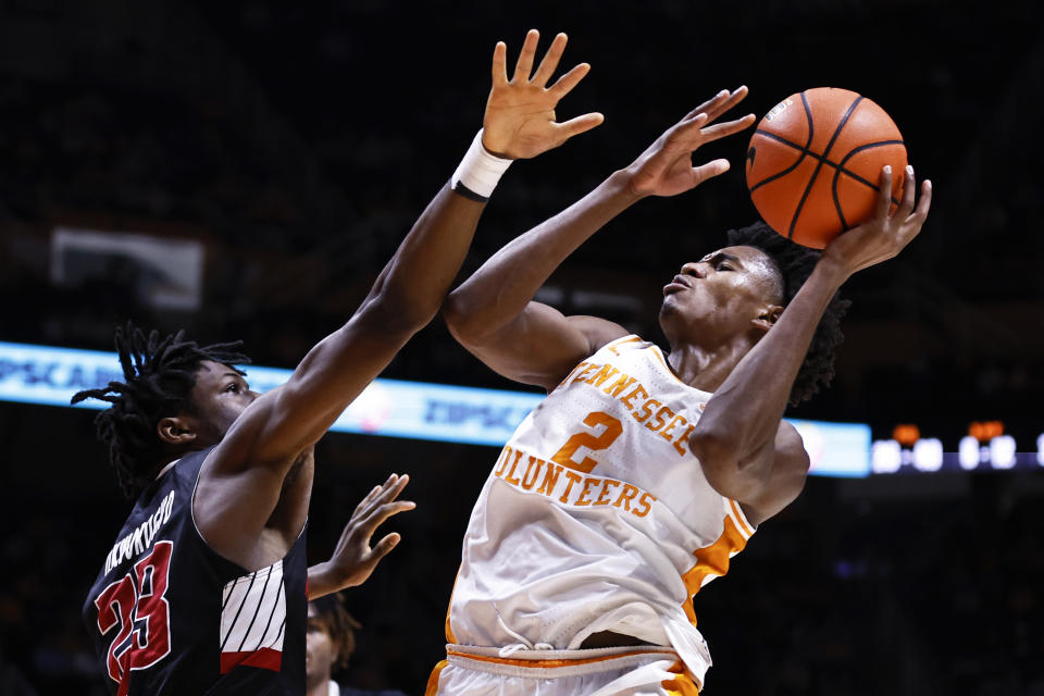 Tennessee forward Julian Phillips (2) shoots over Austin Peay forward Kelechi Okworogwo during the second half of an NCAA college basketball game Wednesday, Dec. 21, 2022, in Knoxville, Tenn. (AP Photo/Wade Payne)