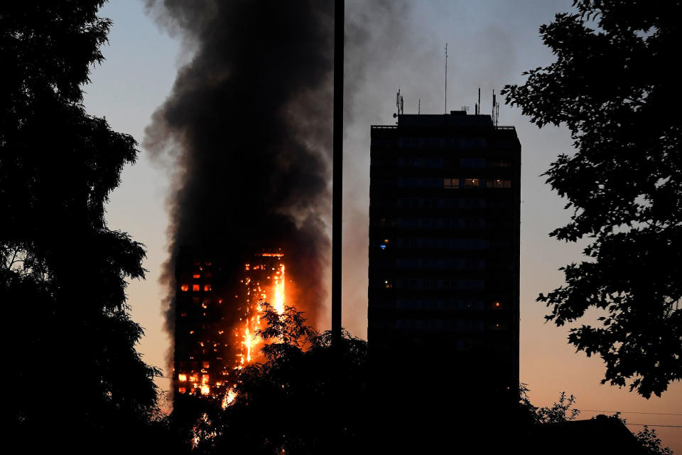 <p>Flames and smoke billow as firefighters deal with a serious fire in a tower block at Latimer Road in West London, Britain June 14, 2017. (Toby Melville/Reuters) </p>