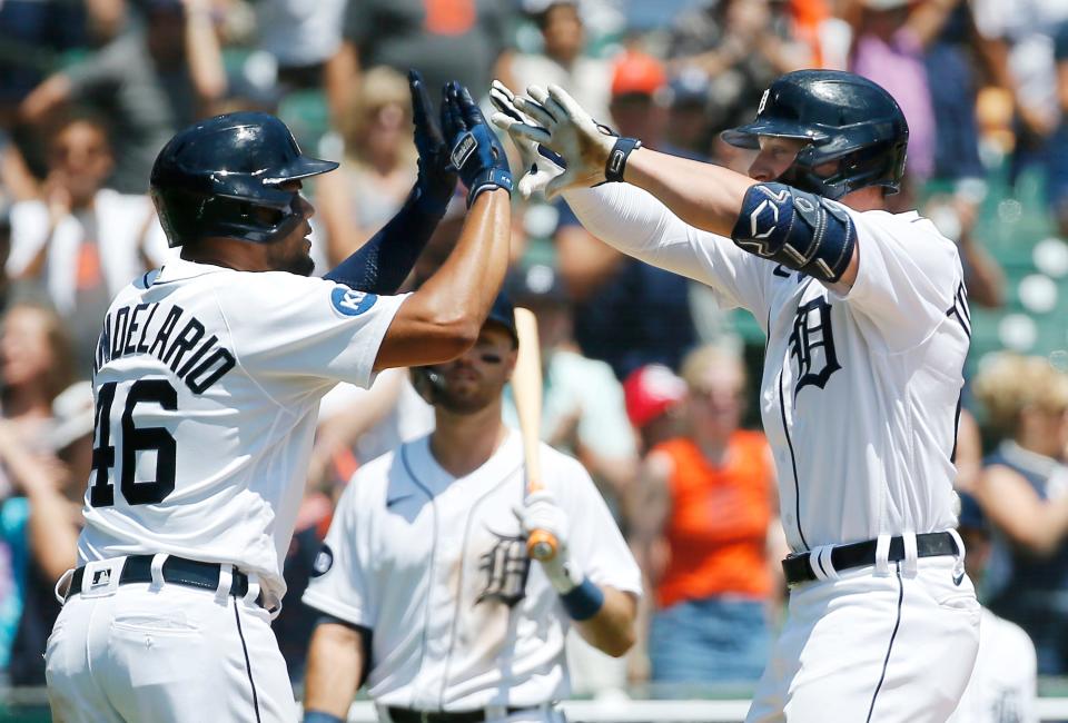Spencer Torkelson (20) of the Detroit Tigers celebrates with Jeimer Candelario (46) after hitting a two-run home run against the Kansas City Royals during the fifth inning at Comerica Park on July 3, 2022, in Detroit, Michigan.