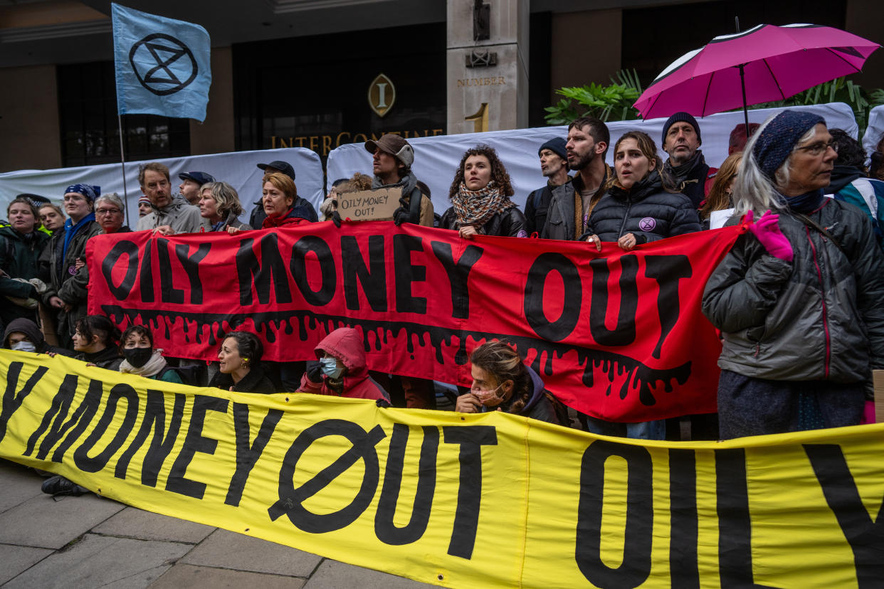 Activists join an environmental protest as during the Energy Intelligence Forum conference. (Photo by Carl Court/Getty Images)