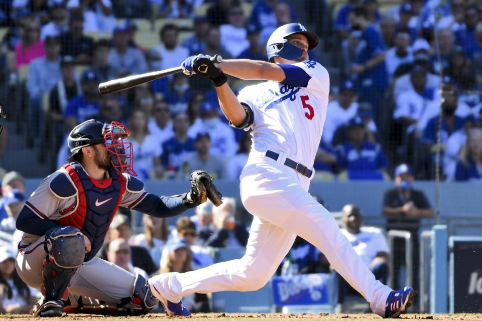 Dodgers' Corey Seager hits a two-run home run during the first inning in Game 3.