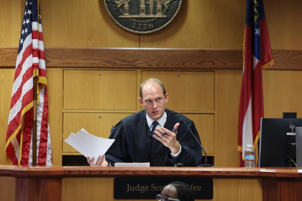 Fulton County Superior Judge Scott McAfee hears motions from attorneys representing Ken Chesebro and Sidney Powell in Atlanta on Wednesday, Sept. 6, 2023.