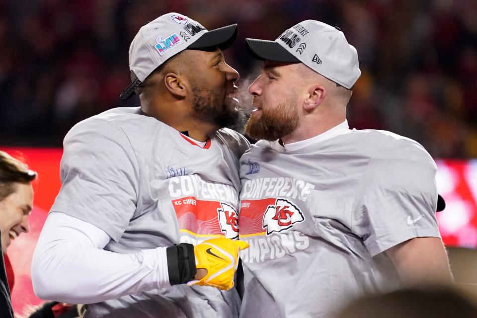 Kansas City Chiefs tight end Travis Kelce, right, and defensive tackle Chris Jones celebrate after the NFL AFC Championship playoff football game against the Cincinnati Bengals, Sunday, Jan. 29, 2023, in Kansas City, Mo. The Chiefs won 23-20. (AP Photo/Brynn Anderson)