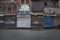 Pigeons fly at a deserted market area during lockdown to stop the spread of the coronavirus in Srinagar, Indian controlled Kashmir, July 22, 2020. Indian-controlled Kashmir's economy is yet to recover from a colossal loss a year after New Delhi scrapped the disputed region's autonomous status and divided it into two federally governed territories. (AP Photo/Mukhtar Khan)