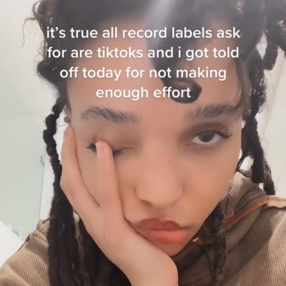 A screenshot from a video that says "It's true, all record labels ask for are TikToks and I got told off for not making enough effort"
