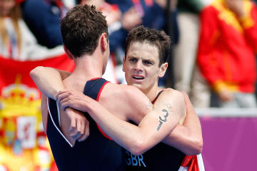 Alistair Brownlee (L) and Jonathan Brownlee celebrate after winning the gold and bronze medal in the Men's Triathlon (Getty Images)