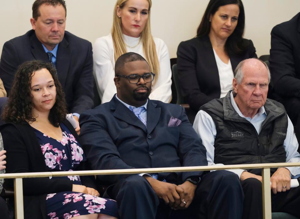 Crystal and Marquess Dennis sit with Gov. Kevin Stitt's father, the Rev. John Stitt, during the governor's State of the State speech.