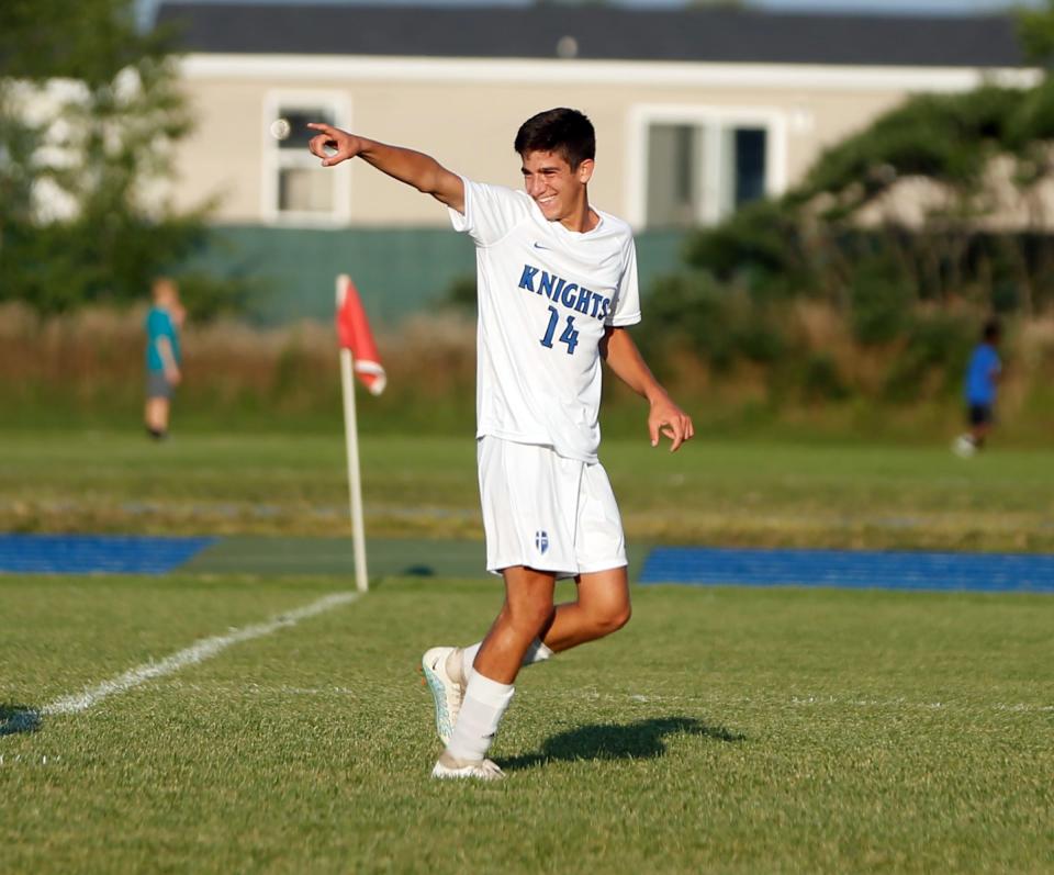 Mishawaka Marian senior Tony Cataldo points toward his teammates after scoring a goal in the first half of a game against Bethany Christian on Monday, Aug. 28, 2023, at Bethany Christian High School in Goshen.