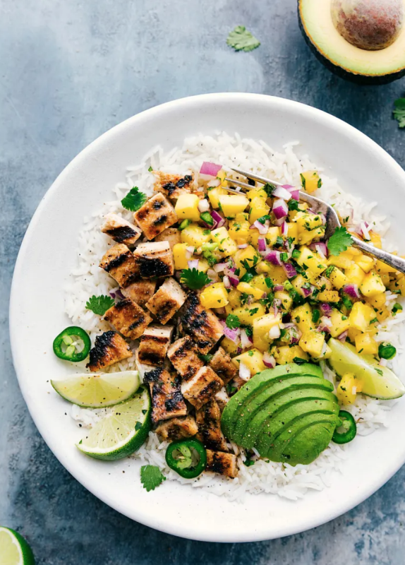 <p>Chelsea's Messy Apron</p><p>Delicious marinated chicken with a simple cilantro pineapple salsa. This pineapple chicken is easy to throw together and mega flavorful!</p><p><strong>Get the recipe: <a href="https://www.chelseasmessyapron.com/grilled-chicken-caramelized-pineapple-salsa-rice-bowl/" rel="nofollow noopener" target="_blank" data-ylk="slk:Grilled Chicken Caramelized Pineapple Salsa Rice Bowl;elm:context_link;itc:0;sec:content-canvas" class="link ">Grilled Chicken Caramelized Pineapple Salsa Rice Bowl</a></strong></p>