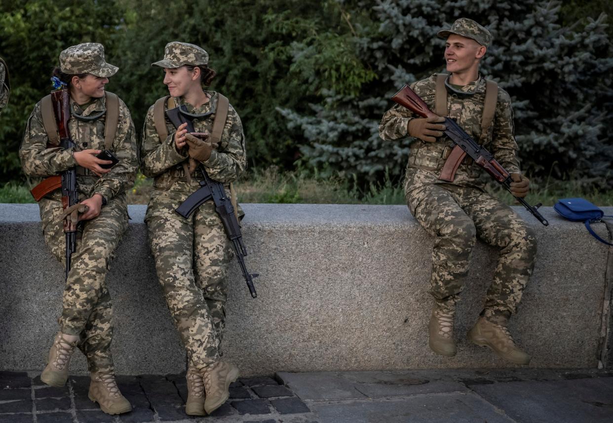 Cadets of Military Institute of Taras Shevchenko National University rest after a swearing-in ceremony at the National Museum of the History of Ukraine in the Second World War (REUTERS)