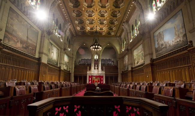 The federal government should outlaw membership in a terrorist group, bar radicals from Canada and look at forbidding the glorification of extremists to protect the Canadian way of life, says a Senate committee. The Senate chamber sits empty on September 12, 2014 in Ottawa. THE CANADIAN PRESS/Adrian Wyld