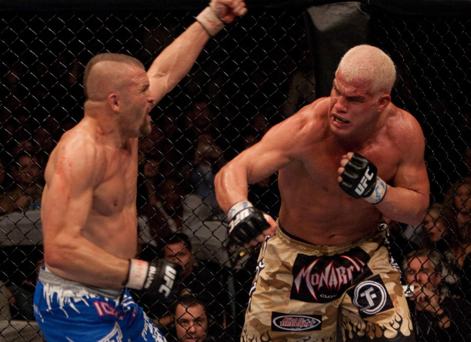 LAS VEGAS - DECEMBER 30:  (R-L) Tito Ortiz punches Chuck Liddell at  UFC 66 at the MGM Grand Garden Arena on December 30, 2006 in Las Vegas, Nevada.  (Photo by Josh Hedges/Zuffa LLC/Zuffa LLC via Getty Images)