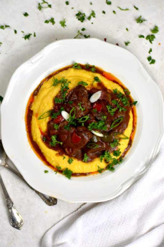 <p>Gypsy Plate</p><p>Grillades 'n' Grits, a Creole classic. Tender medallions of meat simmered in a tomato based gravy over creamy, cheesy grits. You're in for a real treat with this one!</p><p><strong>Get the recipe: <a href="https://gypsyplate.com/grillades-and-grits/" rel="nofollow noopener" target="_blank" data-ylk="slk:Grillades 'n' Grits;elm:context_link;itc:0;sec:content-canvas" class="link ">Grillades 'n' Grits</a></strong></p>