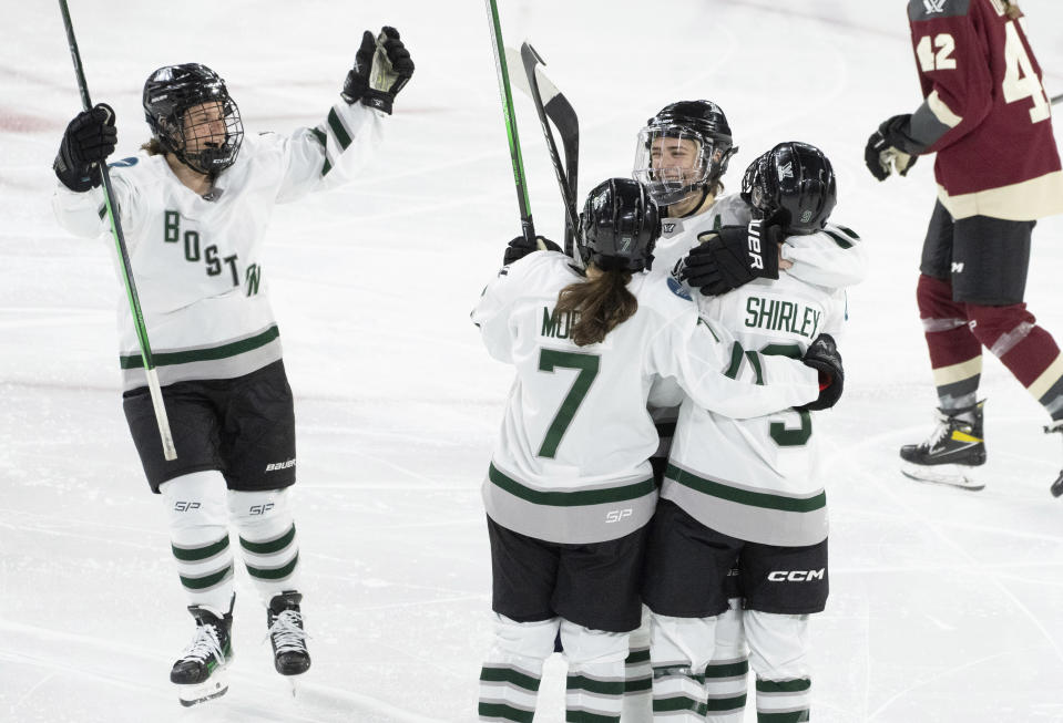 Boston's Sophie Shirley (9) celebrates her goal against Montreal with teammates during the third period of Game 1 of a PWHL hockey playoff series Thursday, May 9, 2024, in Montreal. (Christinne Muschi/The Canadian Press via AP)