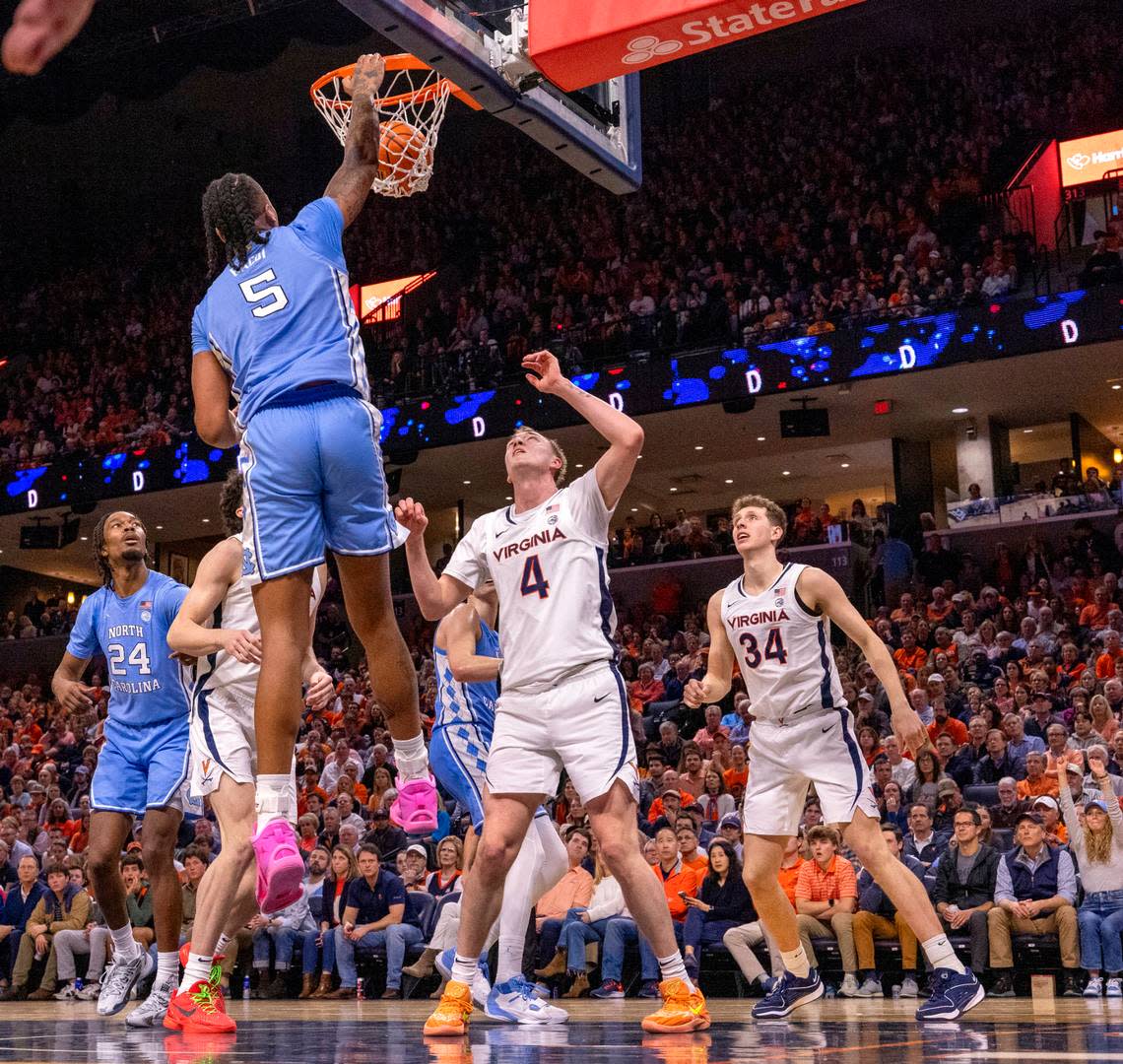 North Carolina’s Armando Bacot (5) gets a dunk over Andrew Rohde (4) in the second half on Saturday, February 24, 2024 at John Paul Jones Arena in Charlottesville, Va.