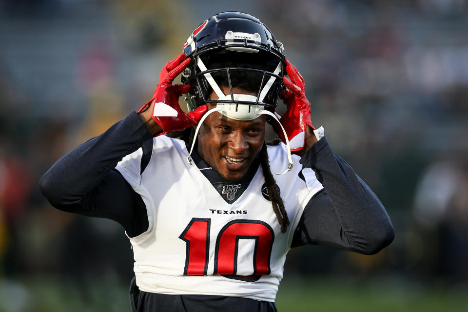  DeAndre Hopkins puts on his helmet as a member of the Texans.