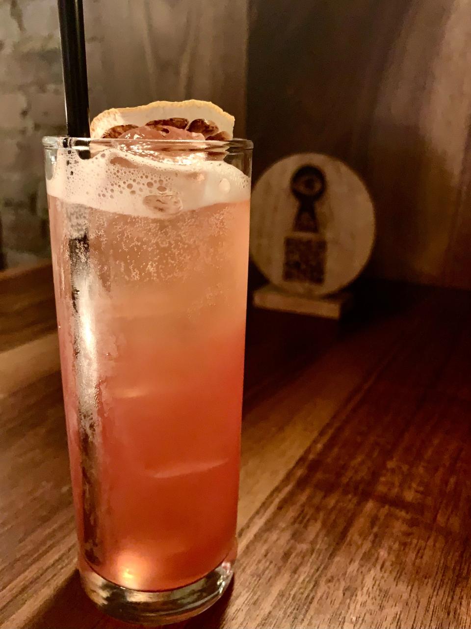 The Plumsucker - a non-alcoholic cocktail from The Red Door bar in Providence featuring spiced rum shrub, spices and lemon.
