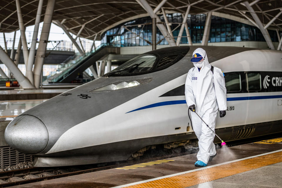 Image: A staff member sprays disinfectant at Wuhan Railway Station in Wuhan in China's central Hubei province (AFP - Getty Images)