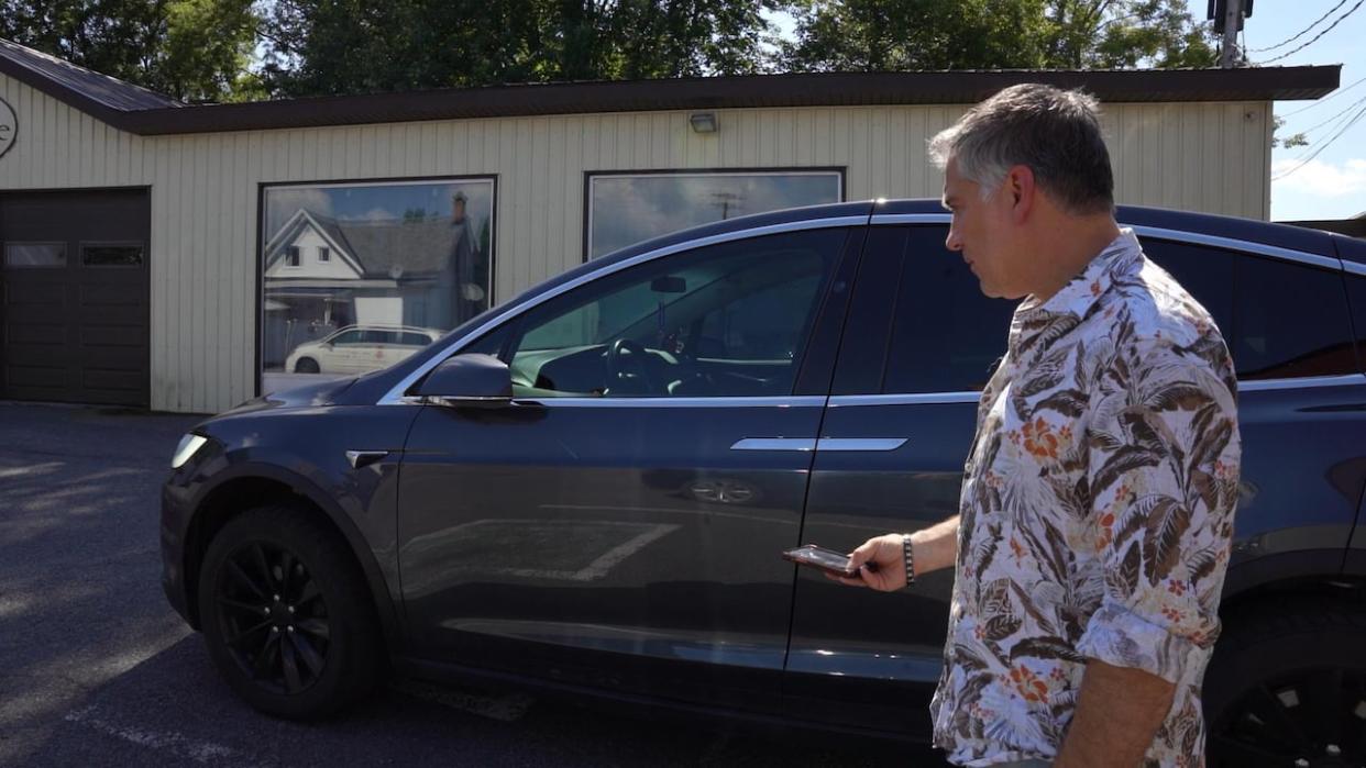 Antonios Tsounourakis installed electric vehicle charging stations at his restaurant in Hawkesbury, Ont., due to what he says is a lack of charging infrastructure between Ottawa and the Quebec border. (Chantal Duduc/CBC - image credit)