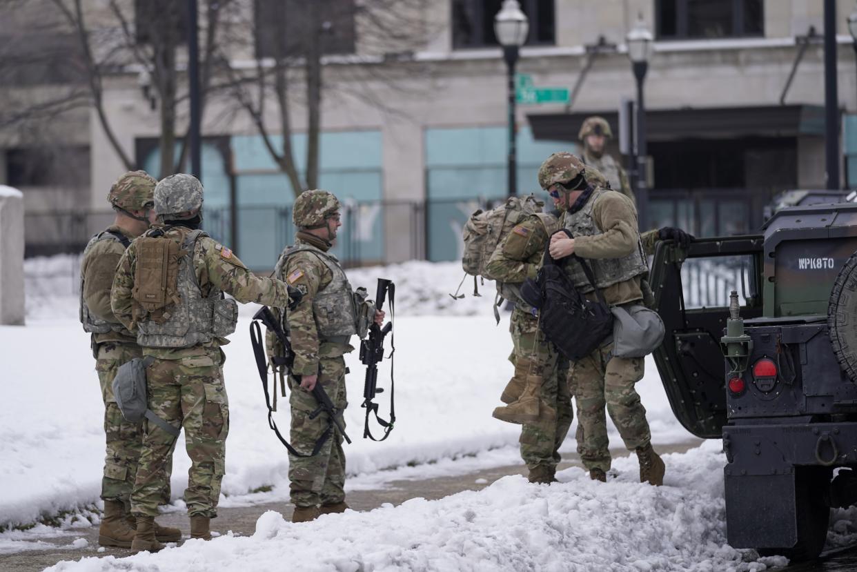 National guard members stage outside a museum Tuesday, Jan. 5, 2021, in Kenosha, Wis. The city of Kenosha is bracing for a charging decision for the white police officer who shot Jacob Blake on Aug. 23. (AP Photo/Morry Gash)