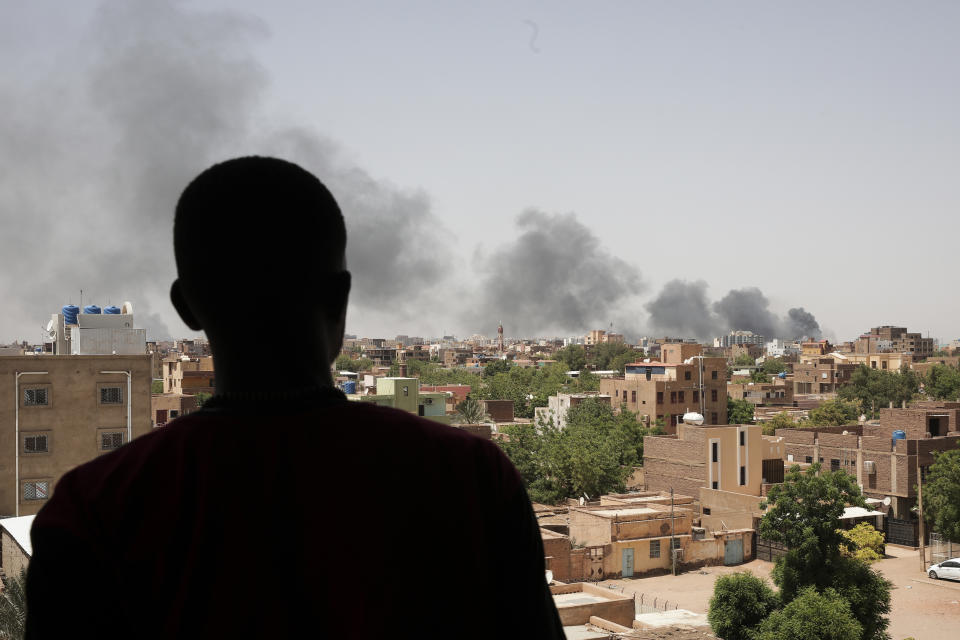 FILE - Smoke is seen in Khartoum, Sudan, Saturday, April 22, 2023. Khartoum, a city of some 5 million people, has been transformed into a front line in the grinding conflict between Gen. Abdel Fattah Burhan, the commander of Sudan’s military, and Gen. Mohammed Hamdan Dagalo, who leads the powerful paramilitary group known as the Rapid Support Forces. The outbreak of violence has dashed once-euphoric hopes for a democratic transition in Sudan after a popular uprising helped oust former dictator Omar al-Bashir. (AP Photo/Marwan Ali, File)