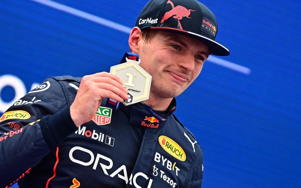 Red Bull Racing's Dutch driver Max Verstappen celebrates after winning the pole position in the sprint qualifying at the Autodromo Internazionale Enzo e Dino Ferrari race track in Imola, Italy, on April 23, 2022, ahead of the Formula One Emilia Romagna Grand Prix - AFP