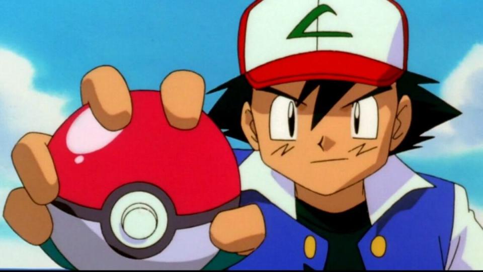 Ash holding a Poke Ball - but how do Poke Balls work?