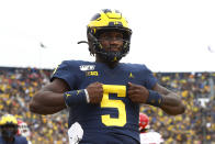 Michigan quarterback Joe Milton celebrates his one-yard touchdown run in the second half of an NCAA college football game against Rutgers in Ann Arbor, Mich., Saturday, Sept. 28, 2019. (AP Photo/Paul Sancya)