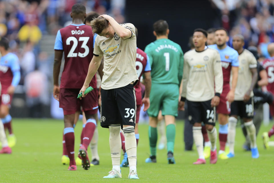 Manchester United's Scott McTominay salutes supporters at at the end of the English Premier League soccer match between West Ham and Manchester United at London stadium in London, Sunday, Sept. 22, 2019. West Ham beat Manchester United 2-0. (AP Photo/Leila Coker)