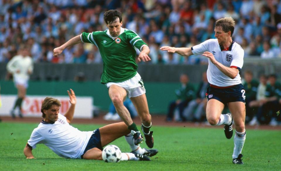 Tony Galvin skips past Glenn Hoddle and Gary Stevens in Stuttgart, West Germany, during Euro 88 (Getty)